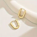 Rectangle hoop earrings in gold, worn