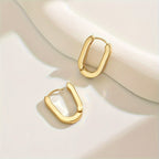 Rectangle hoop earrings in gold, worn