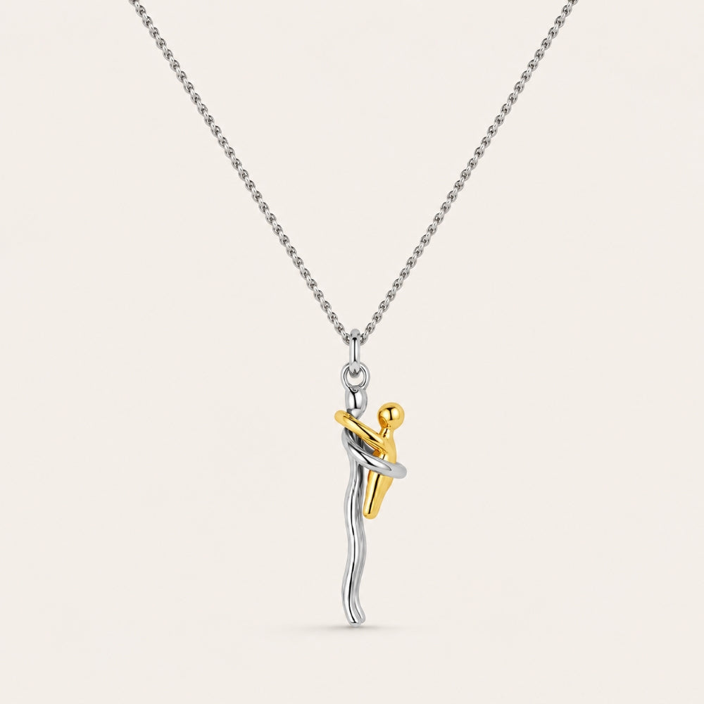 Mother and child pendant in silver and gold on a fine silver chain