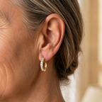 Crystal huggie hoop earrings, close view of the crystal band