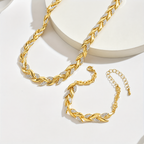 Fishtail Chain Set in gold, necklace and bracelet laid flat