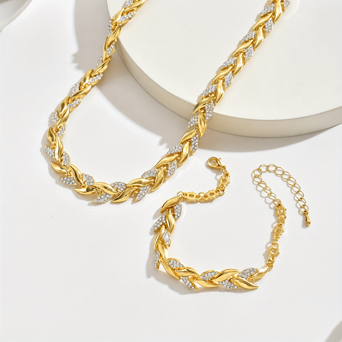 Fishtail Chain Set in gold, necklace and bracelet laid flat