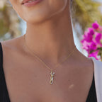 Model wearing the hugging couple necklace